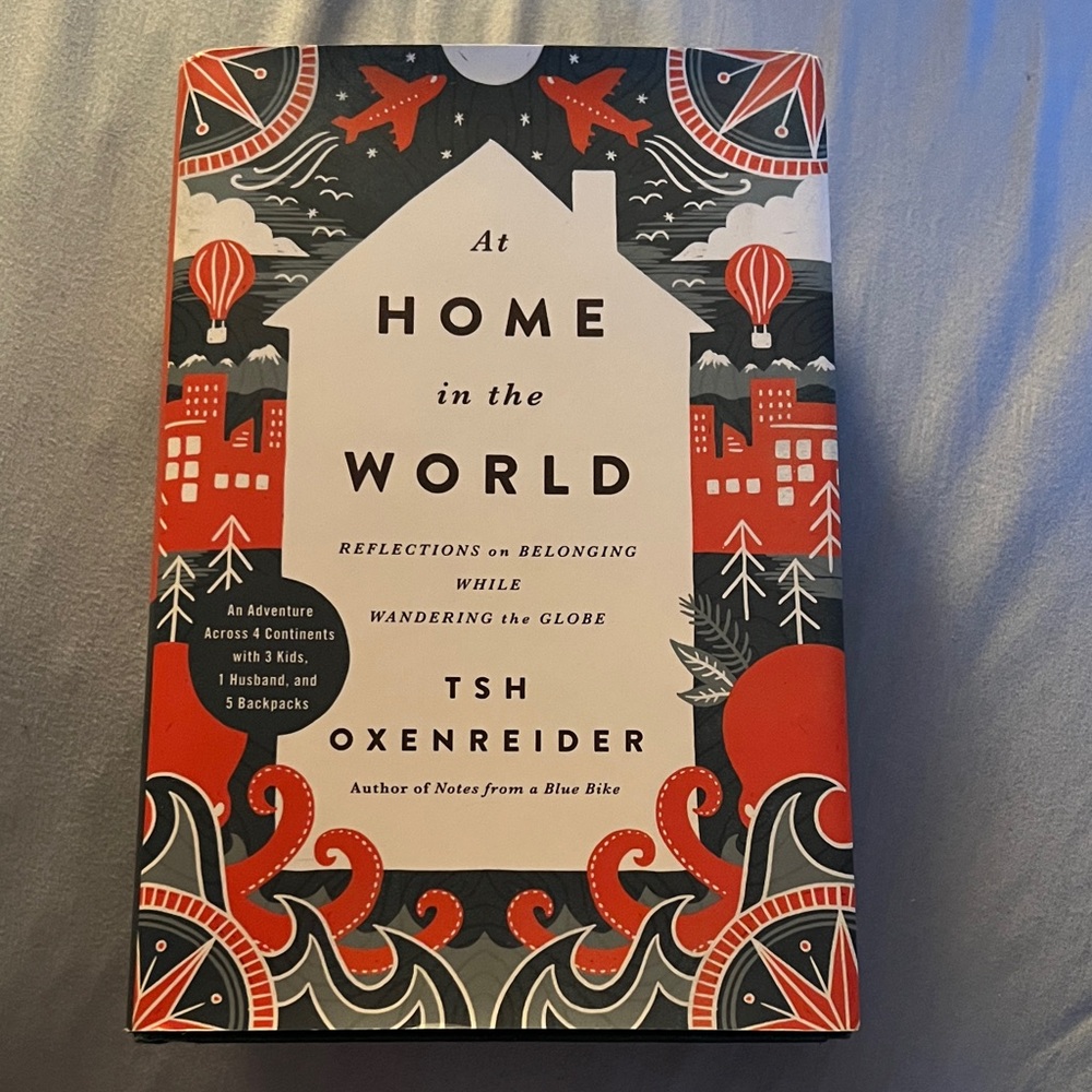 'At Home in the World' Coffee Table Book - Red and Black Cover